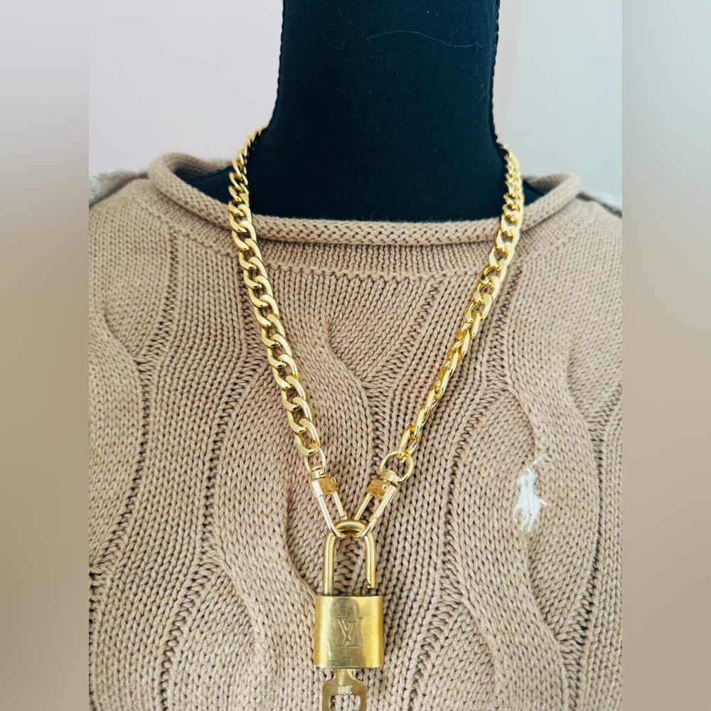 LV brass lock and key